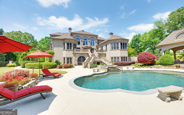 view of swimming pool with a patio area