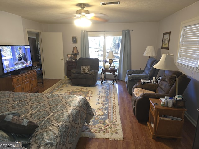 bedroom featuring ceiling fan and dark hardwood / wood-style flooring