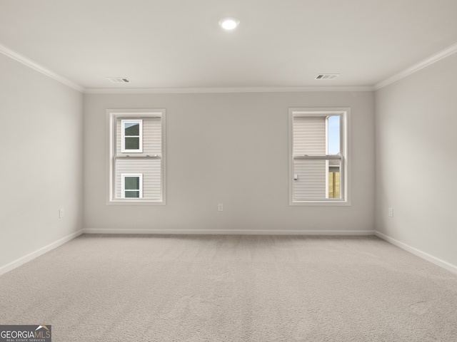 unfurnished room with light carpet and ornamental molding