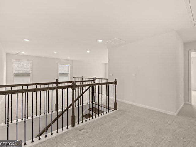 hallway featuring carpet floors