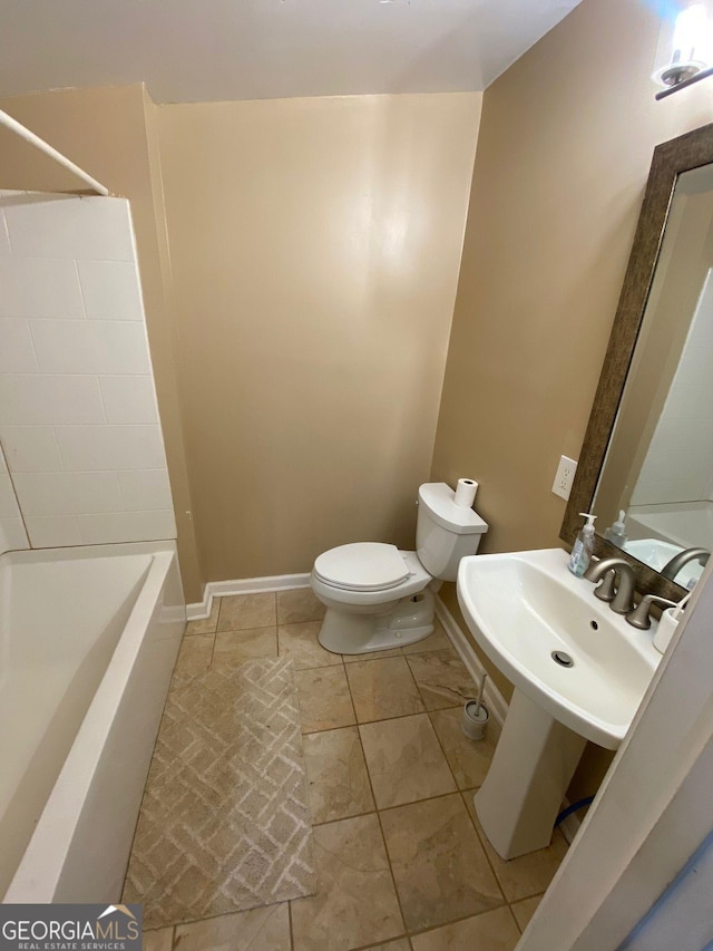 full bathroom with sink, toilet, tile patterned flooring, and  shower combination