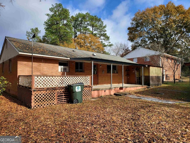 rear view of house with covered porch