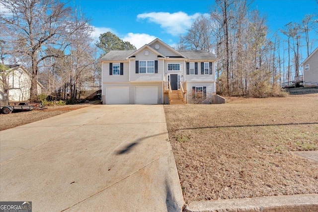 bi-level home featuring a front yard and a garage