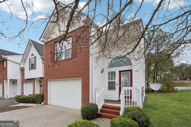 view of property with a front lawn and a garage