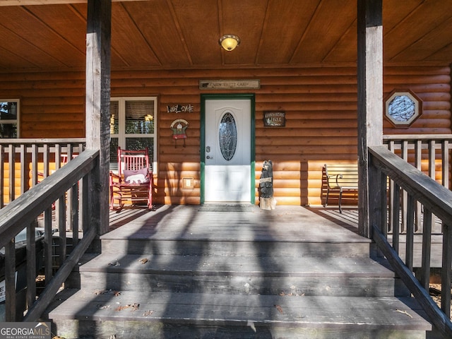 doorway to property featuring covered porch