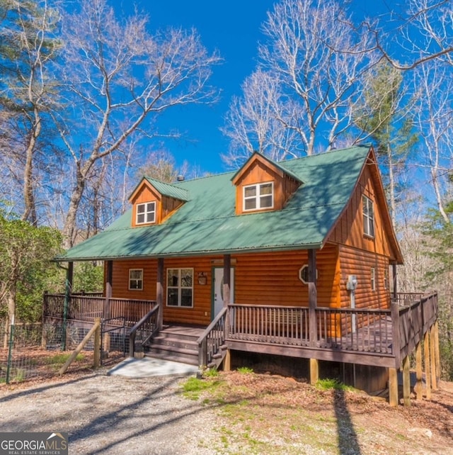 log-style house with a porch