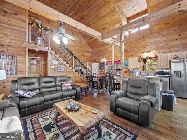 living room featuring hardwood / wood-style flooring, beam ceiling, wood ceiling, and high vaulted ceiling