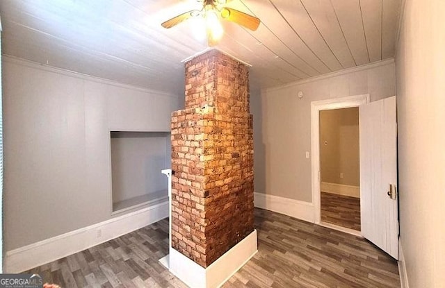 interior space with ceiling fan, wood ceiling, wood finished floors, and ornamental molding