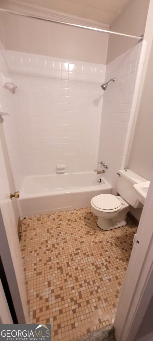 full bathroom featuring toilet and bathing tub / shower combination