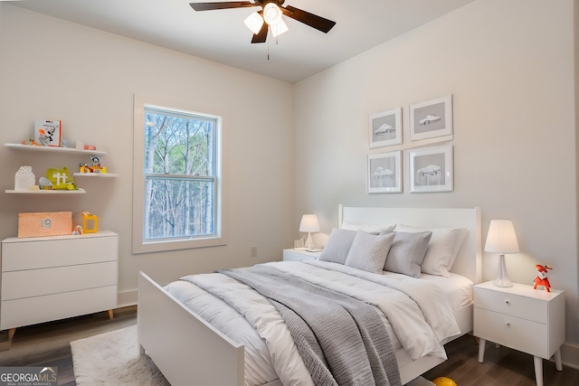 bedroom featuring dark wood-type flooring and a ceiling fan