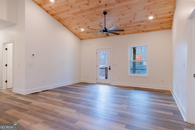 unfurnished living room with wood finished floors, a ceiling fan, baseboards, high vaulted ceiling, and wood ceiling