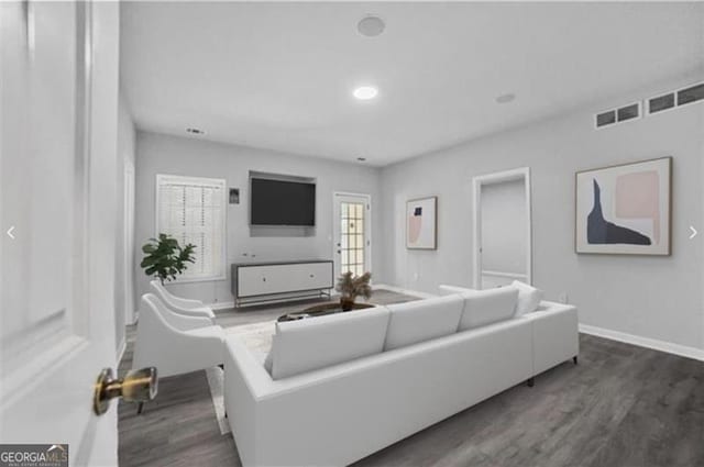 living room with dark hardwood / wood-style flooring