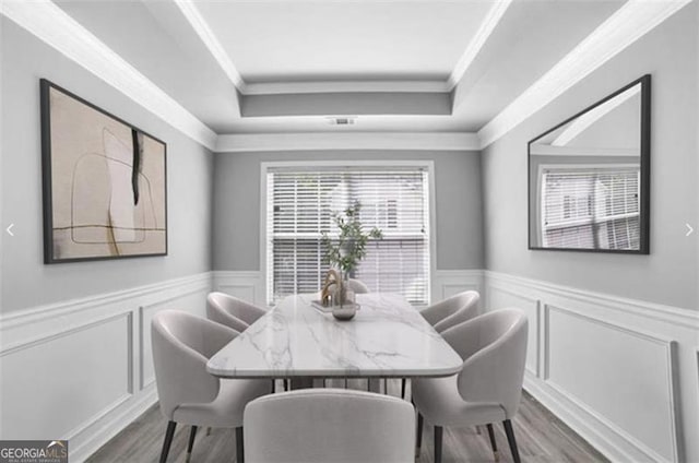 dining room with wood-type flooring