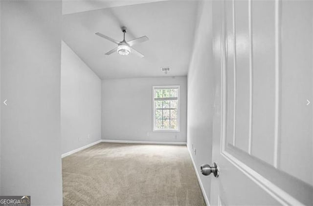 additional living space featuring light colored carpet and ceiling fan