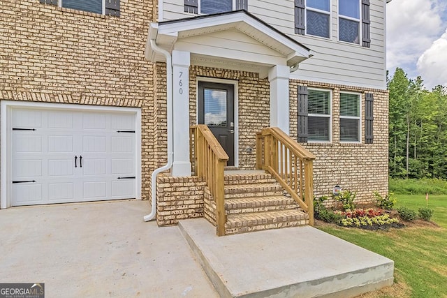 view of exterior entry with a garage