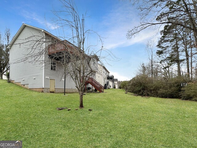 view of property exterior featuring a lawn