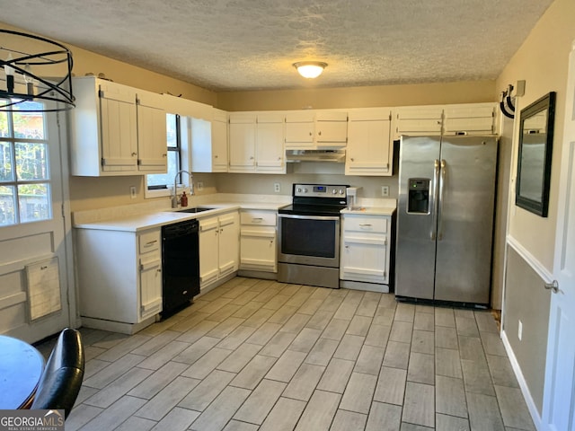 kitchen featuring plenty of natural light, stainless steel appliances, sink, and white cabinets