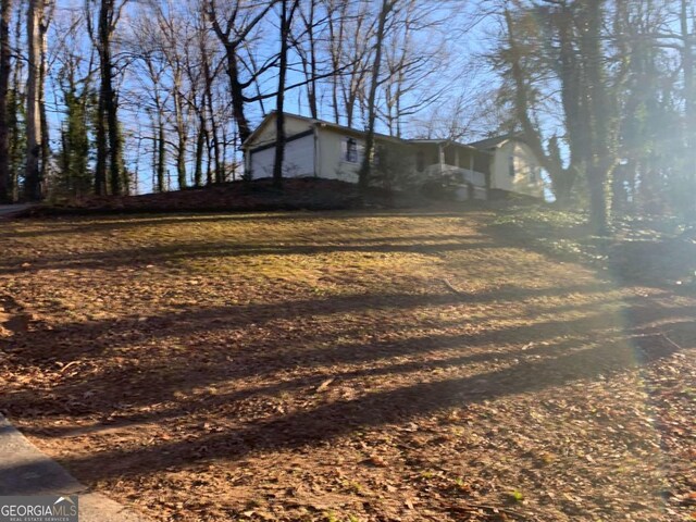 view of yard featuring a garage