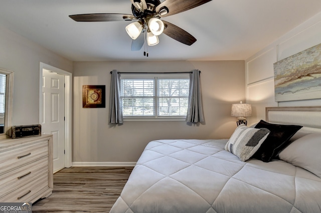 bedroom featuring ceiling fan and wood-type flooring