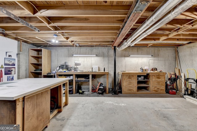 basement with a workshop area