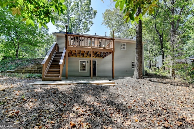 rear view of property with a patio area and a deck