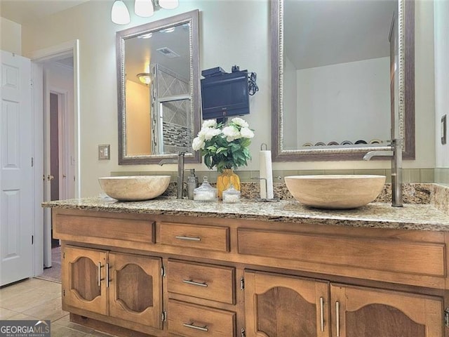 bathroom featuring vanity and tile patterned flooring