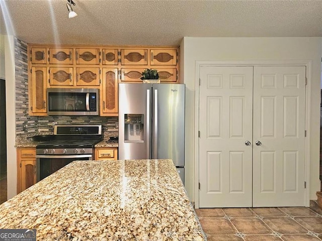 bathroom featuring tasteful backsplash, vanity, and toilet