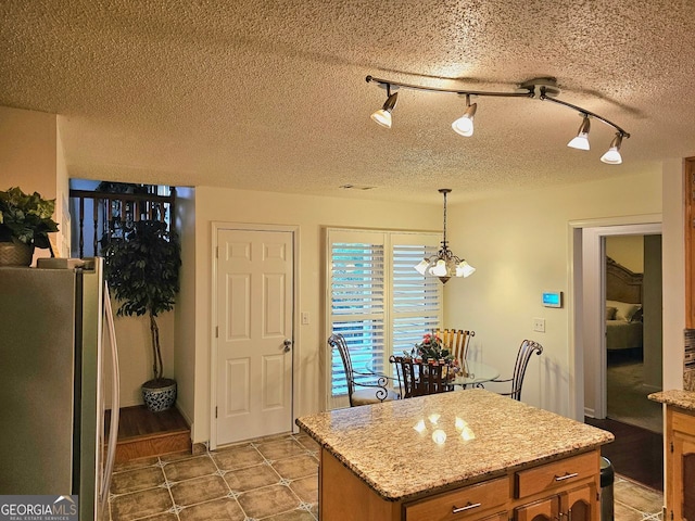 dining space featuring ceiling fan, lofted ceiling, hardwood / wood-style floors, and a textured ceiling