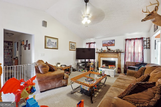 carpeted living room featuring ceiling fan, a textured ceiling, and vaulted ceiling