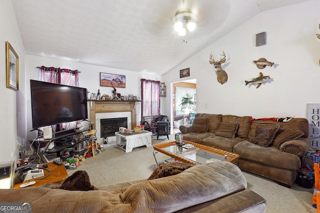 carpeted living room with a textured ceiling, ceiling fan, and lofted ceiling