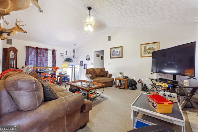 carpeted living room featuring a textured ceiling, ceiling fan, and lofted ceiling