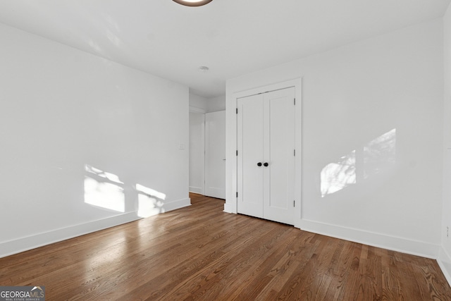 spare room featuring hardwood / wood-style flooring