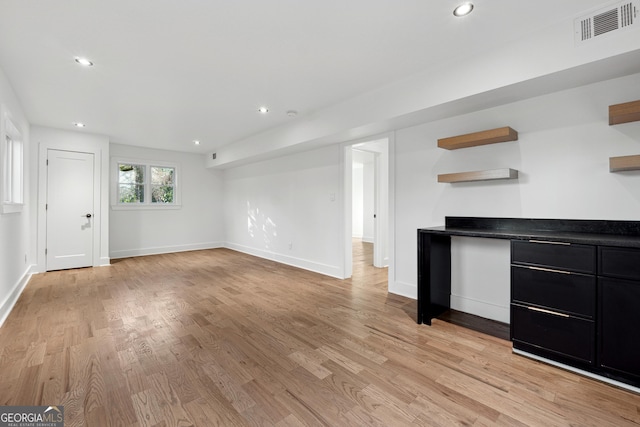 unfurnished living room with light hardwood / wood-style flooring