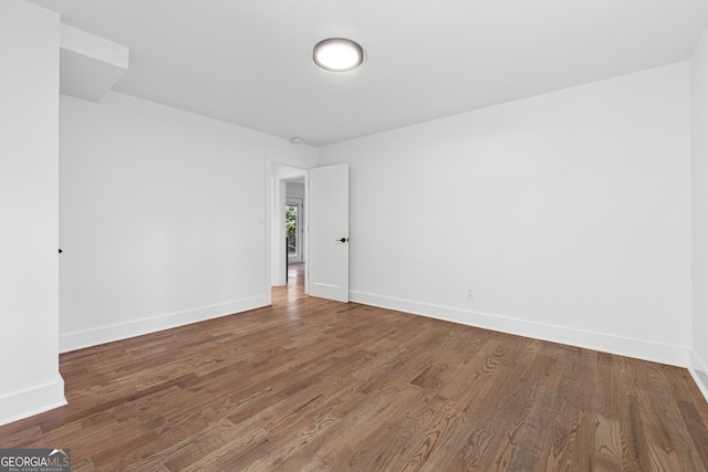 spare room with hardwood / wood-style flooring