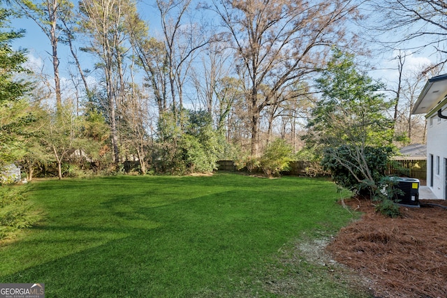 view of yard featuring central air condition unit