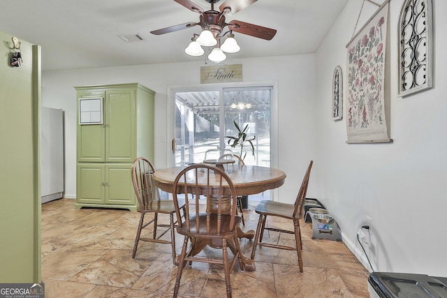 dining space with ceiling fan