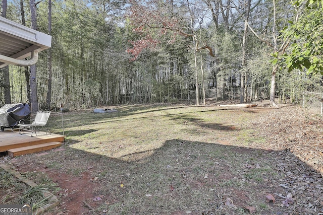 view of yard featuring a wooden deck