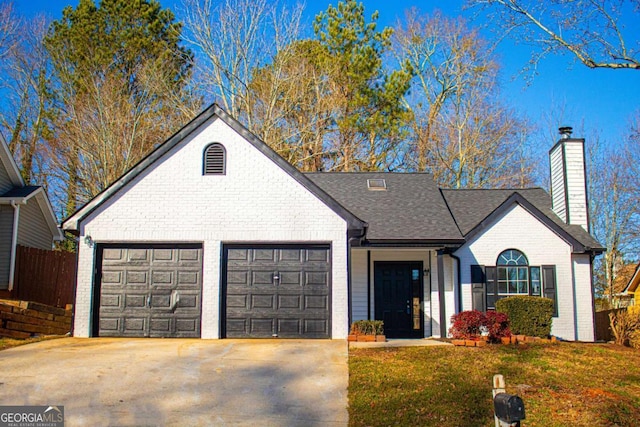 ranch-style house with a garage and a front yard