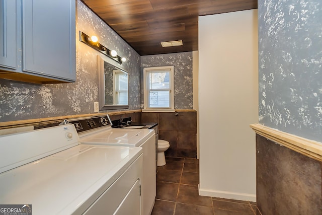 bathroom with vanity, tile patterned flooring, toilet, separate washer and dryer, and wood ceiling