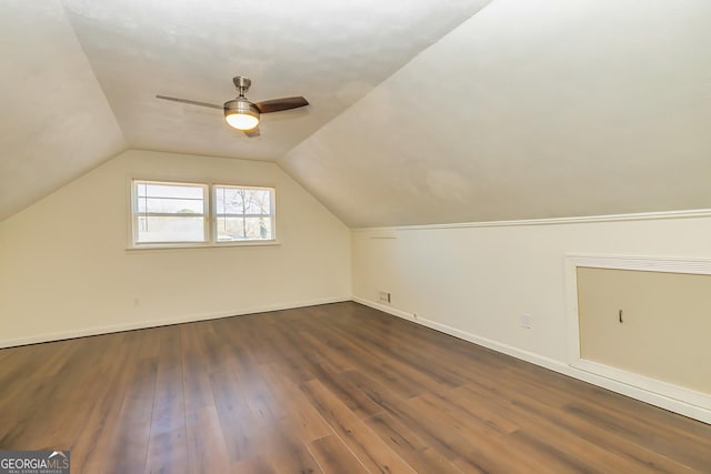 additional living space featuring ceiling fan, dark hardwood / wood-style flooring, and lofted ceiling