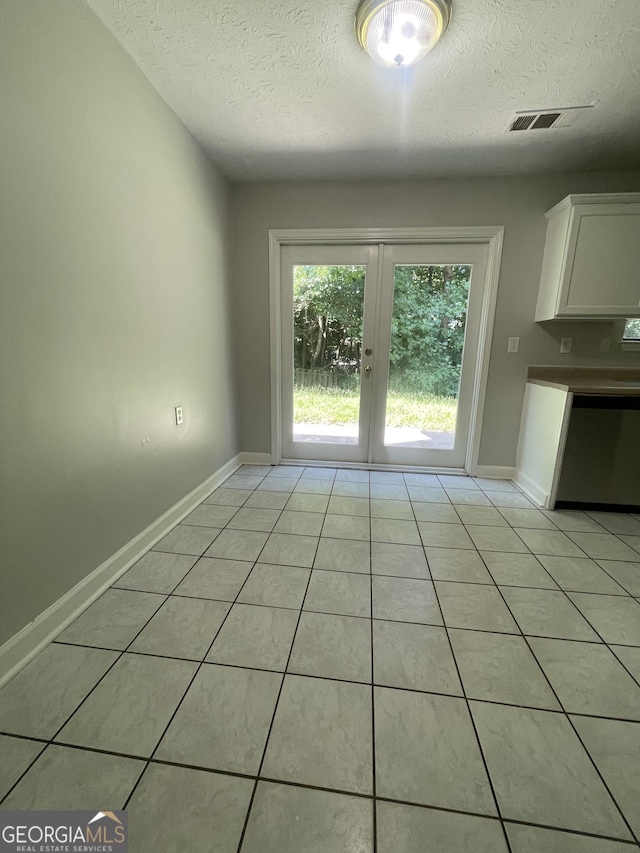 unfurnished living room featuring lofted ceiling, dark wood-type flooring, ceiling fan, a textured ceiling, and a tiled fireplace