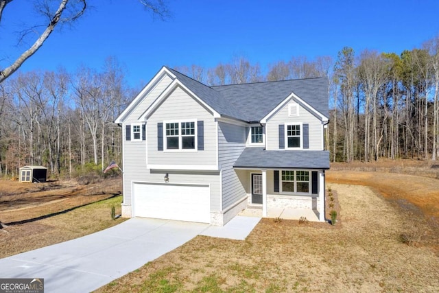 view of front property featuring a garage and a front lawn