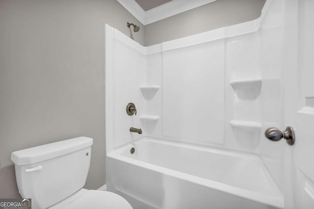 bathroom featuring crown molding, shower / washtub combination, and toilet