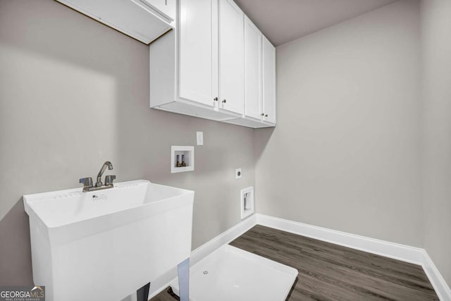 laundry room with sink, washer hookup, cabinets, hookup for an electric dryer, and dark hardwood / wood-style flooring