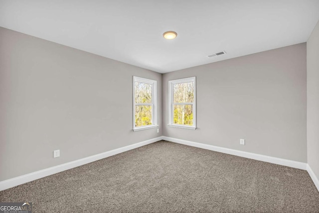 unfurnished room with carpet