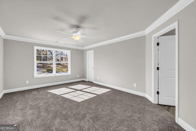 carpeted empty room featuring ceiling fan and ornamental molding