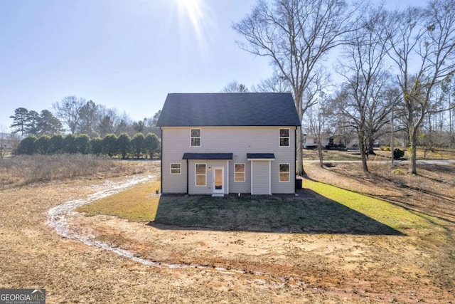 view of front of home with a front yard