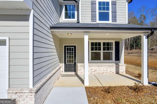 doorway to property featuring a porch