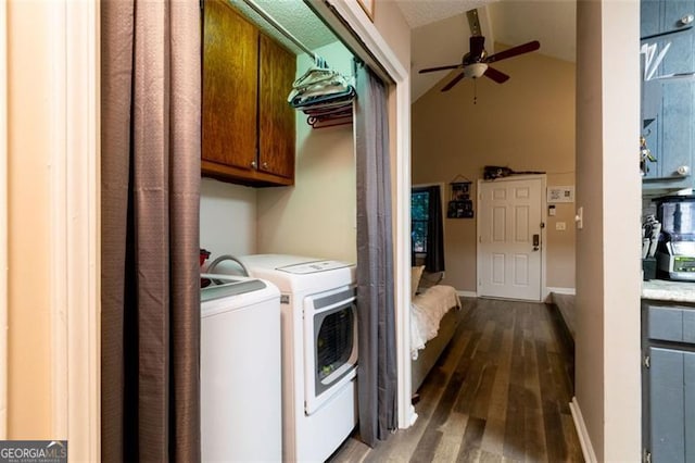 clothes washing area with washer and clothes dryer, ceiling fan, cabinets, and dark wood-type flooring