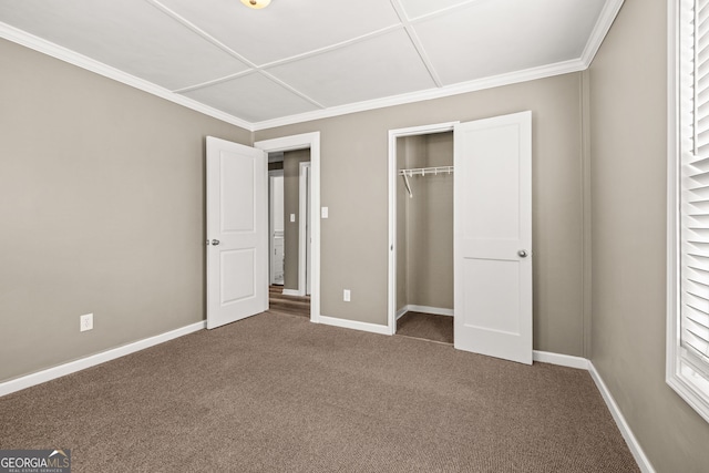 unfurnished bedroom featuring carpet flooring, crown molding, and a closet